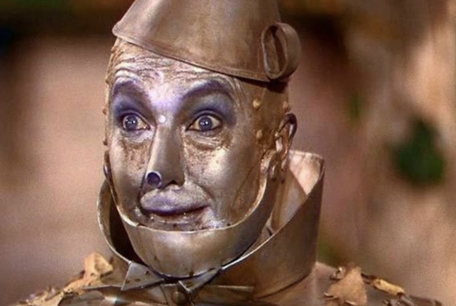 An image of the tin man from the 1936 Wizard of Oz film, wide-eyed, symbolizing the piecemeal upgrade from one form to another.