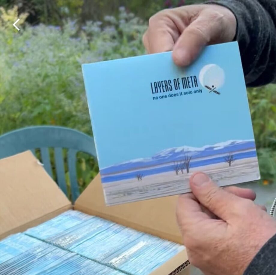A still shot from the video showing me holding the very first CD from the batch to be opened.